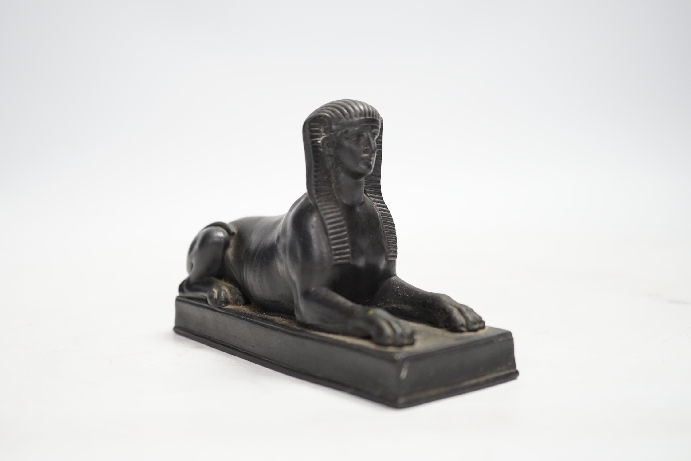 A 19th century Wedgwood basalt model of a sphinx. Condition - loss to tail, minor rubbing, fair